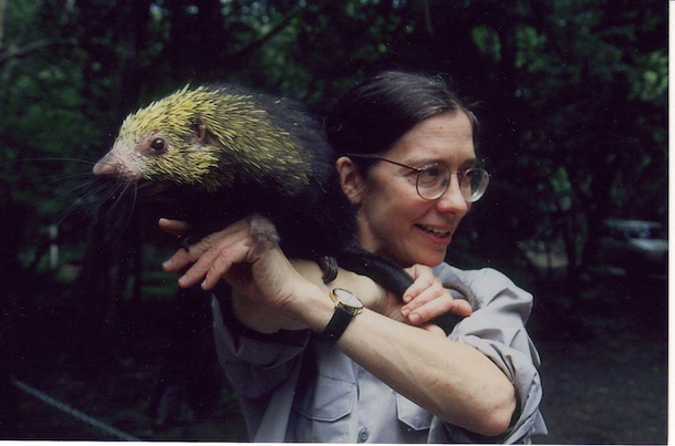 Winnie Hallwachs looking to side, porcupine Espinita more interested in photographer Eric Greene